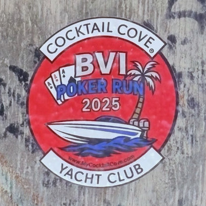 The round red BVI Poker Run 2025 sticker out in the wild, on a sticker-covered beach bar wall