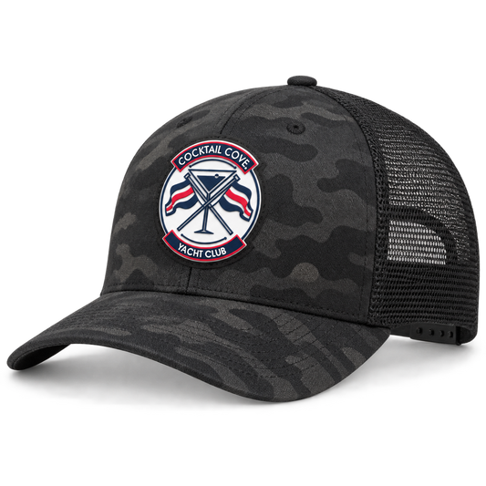 Black camo Cocktail Cove Yacht Club trucker hat with the club badge patch, side angle