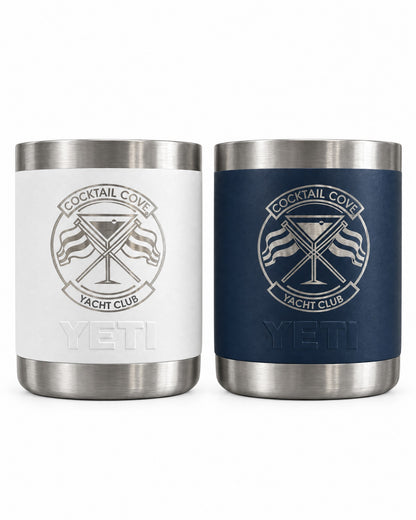 White and navy YETI Rambler 10oz Lowballs engraved with the Cocktail Cove Yacht Club crest