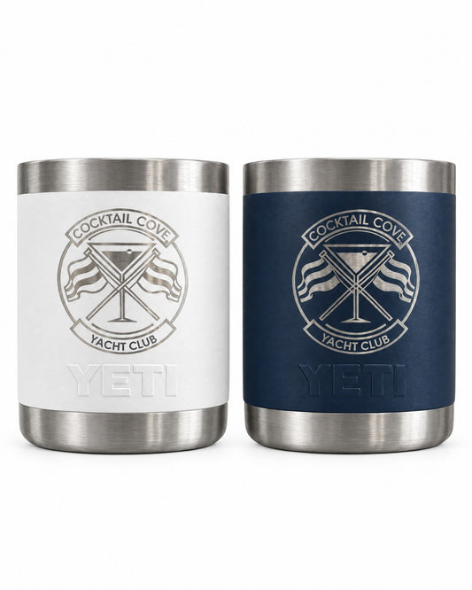 White and navy YETI Rambler 10oz Lowballs engraved with the Cocktail Cove Yacht Club crest