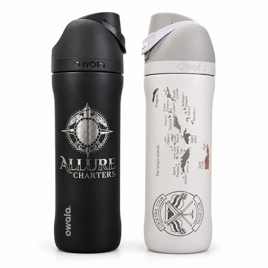 Custom Crew Owala FreeSip bottles in black and white, laser engraved with a charter logo and the Virgin Islands chart with the Cocktail Cove Yacht Club badge