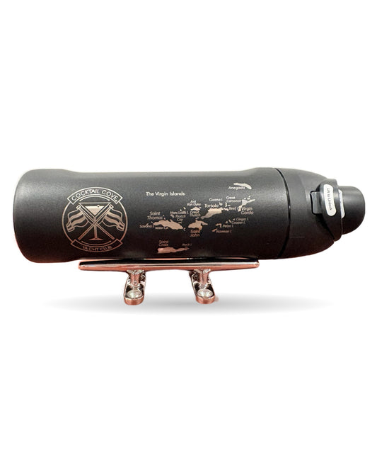 Black Virgin Islands Owala FreeSip 24oz resting on a chrome boat cleat, engraved with the Virgin Islands map and the Cocktail Cove Yacht Club crest