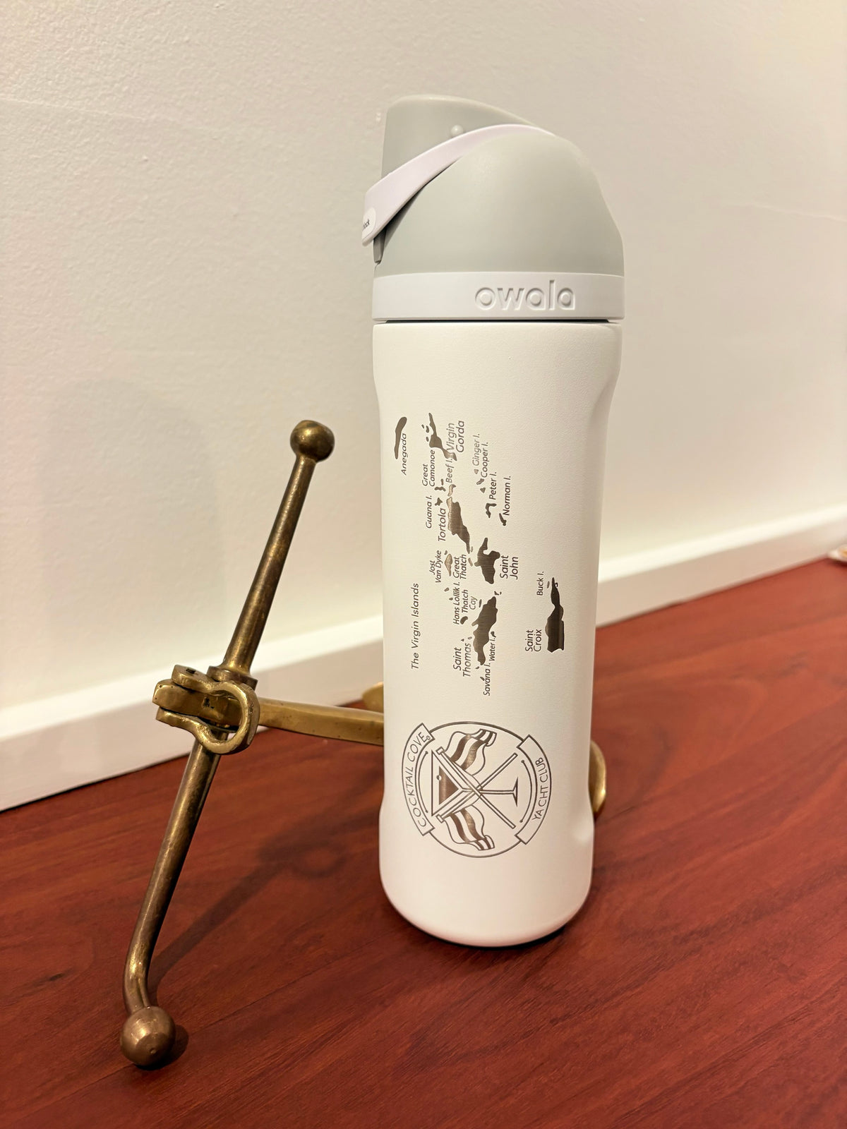 White Virgin Islands Owala FreeSip beside a brass boat cleat stand